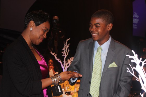Marcus Burns (Jacksonville) receives graduation ring from mom at commencement